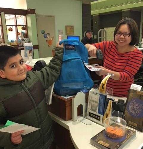 Boy taking home a kit.